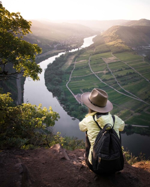 Piscoandbier watching sunrise overlooking Mosel bend in Germany
