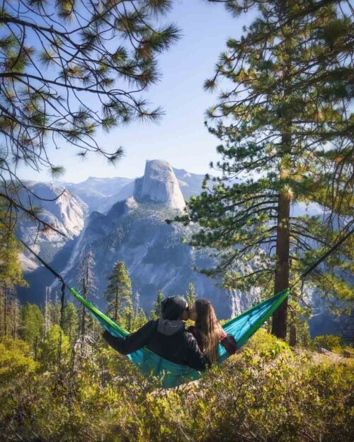 Hammocking at Yosemite National Park with a view of Half Dome from Glacier Point