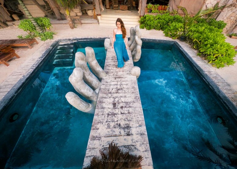 Vagalume Tulum Hotel pool with hands bridge