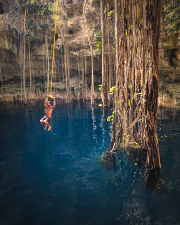 Rope swing at Hacienda Oxman Cenote In Valladolid